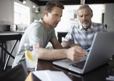 Men working on laptop